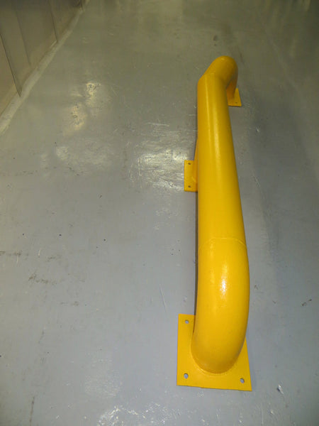 Pair of yellow loading bay wheel guides with splayed ends