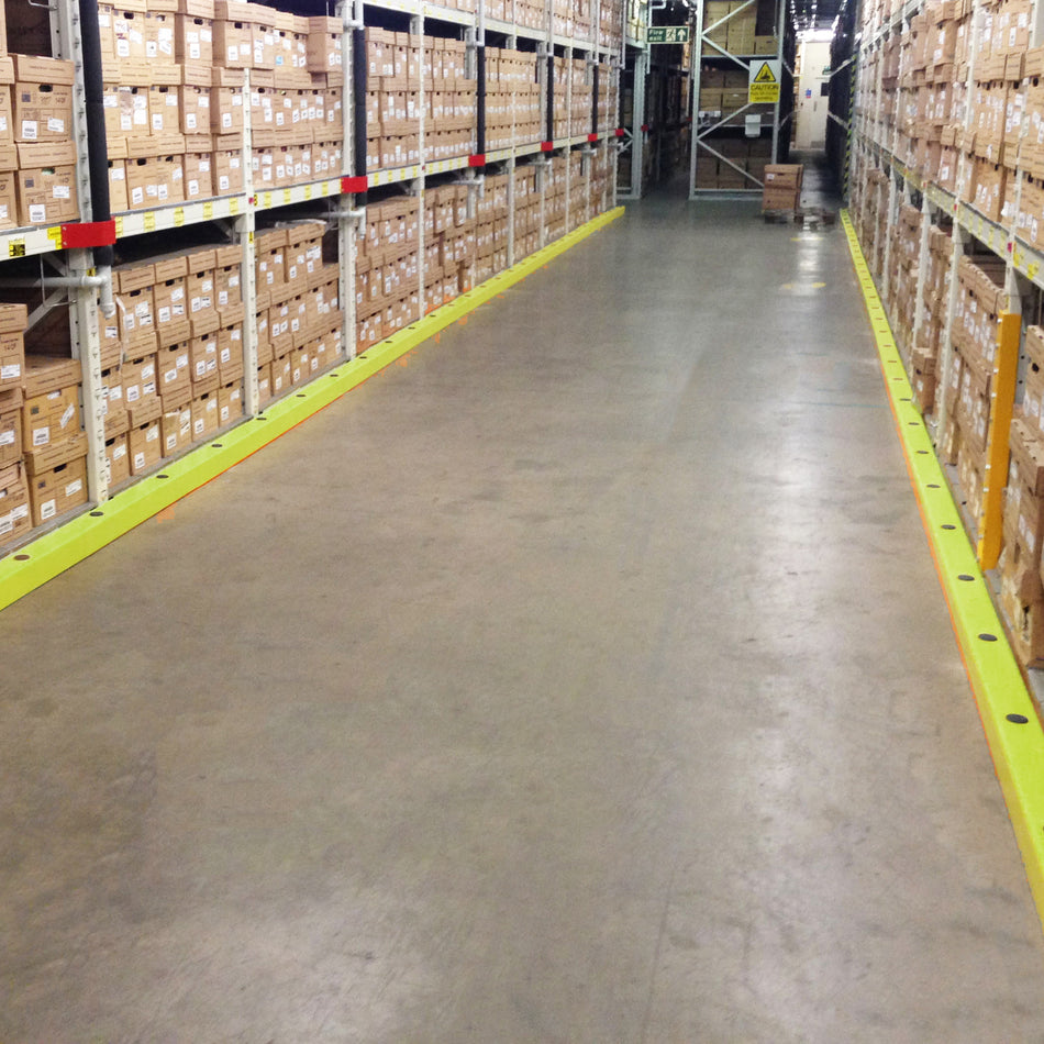 Floor level barrier in yellow HDPE polymer for warehouse impact protection